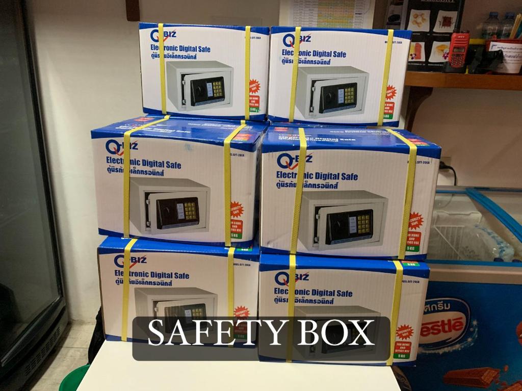 a stack of boxes with a safety box on top at Surin Bay Inn in Surin Beach