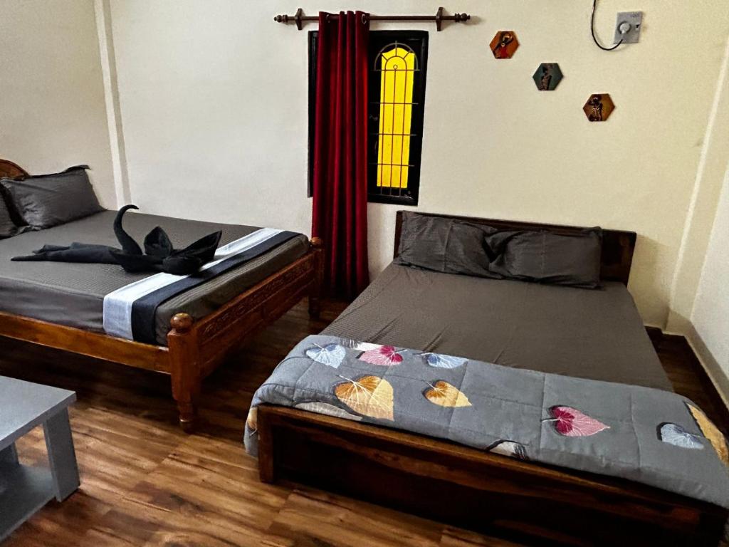 Postel nebo postele na pokoji v ubytování Le'SAP Beach resort