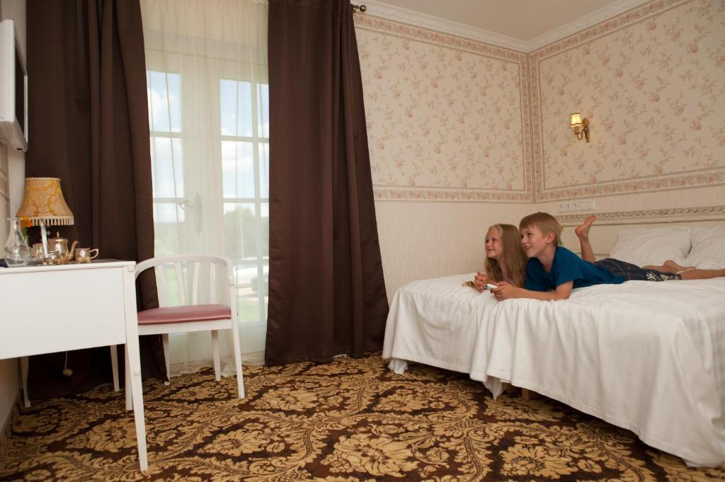 Postel nebo postele na pokoji v ubytování Ööbikuoru Villa