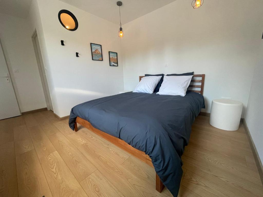 Postel nebo postele na pokoji v ubytování L'Atelier