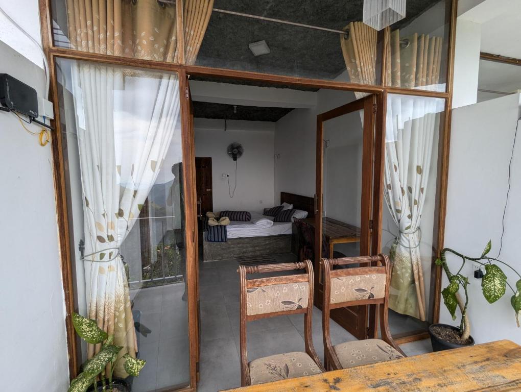 Postel nebo postele na pokoji v ubytování Rock Paradise Homestay