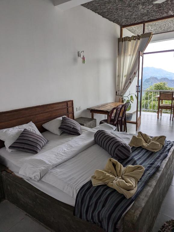 Postel nebo postele na pokoji v ubytování Rock Paradise Homestay