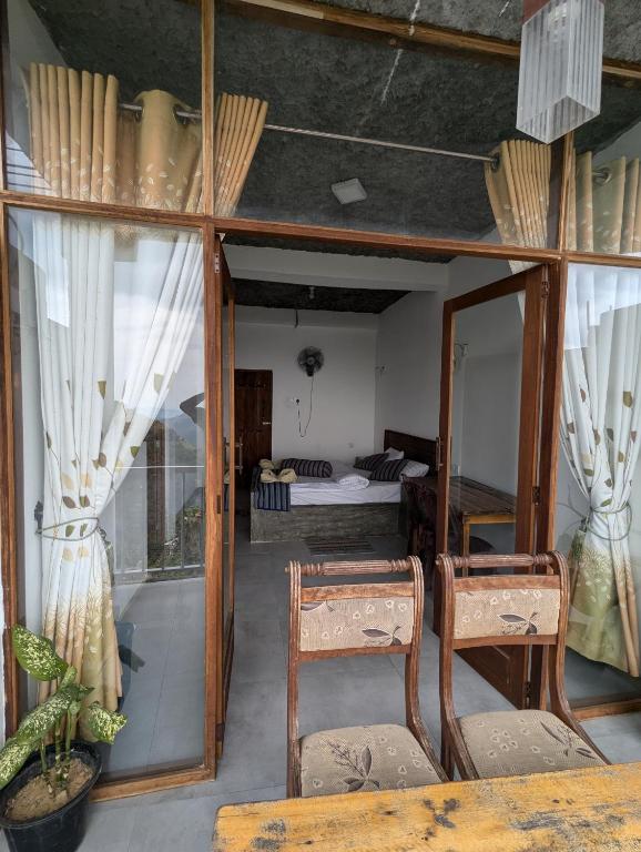 Postel nebo postele na pokoji v ubytování Rock Paradise Homestay