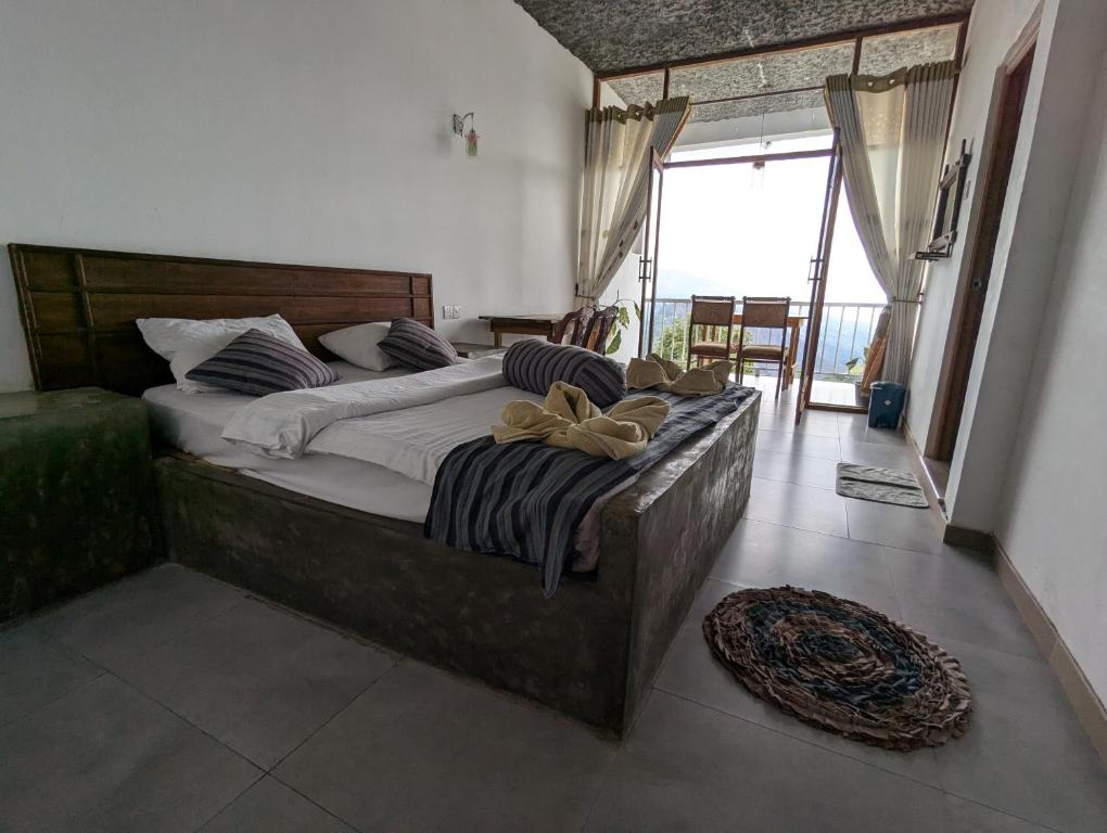 Postel nebo postele na pokoji v ubytování Rock Paradise Homestay