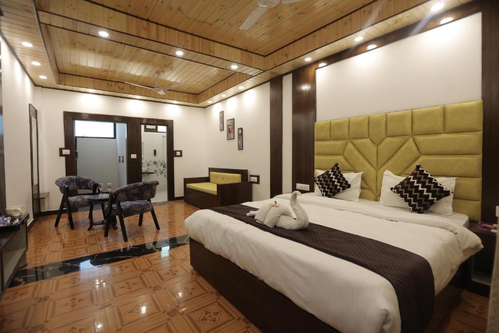 Postel nebo postele na pokoji v ubytování StudioZ Paradise Hills Mussoorie