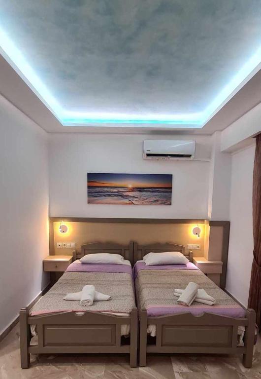 Postel nebo postele na pokoji v ubytování Luis Apartments