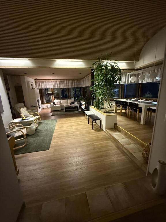 a living room with a couch and a table at Riverside Villa Aurora in Rovaniemi