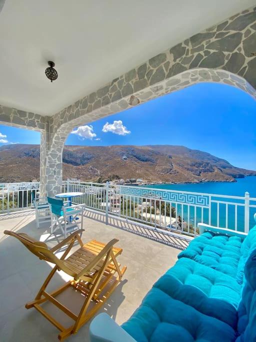 a balcony with chairs and a view of the ocean at Kalimera Apartment in Kalymnos