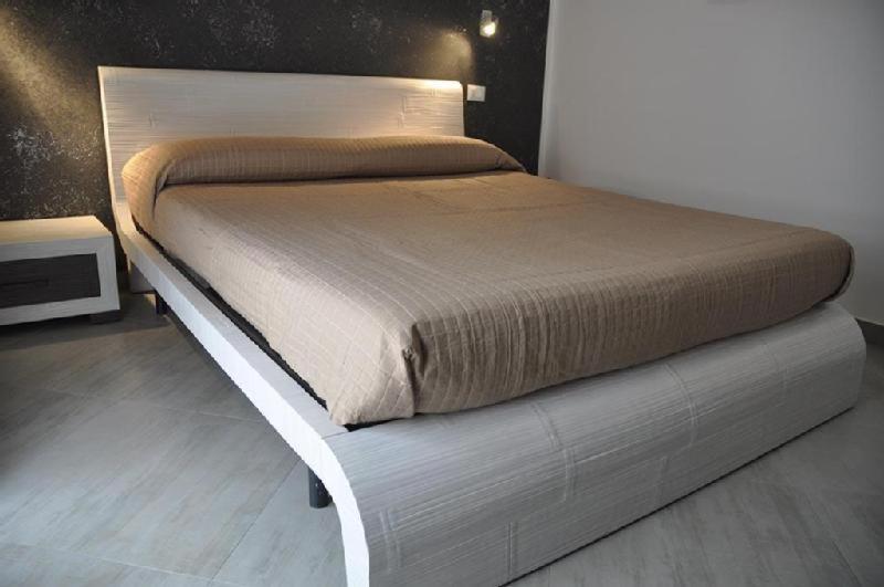 A bed or beds in a room at B&B Il Sole