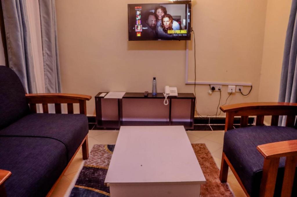 Posezení v ubytování Dayo Suites and Hotel
