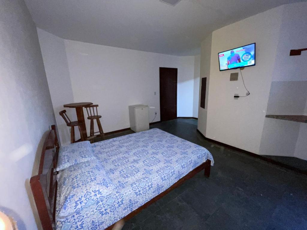 Cama ou camas em um quarto em Pousada Terra Do Sol
