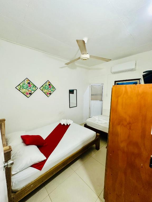 Postel nebo postele na pokoji v ubytování Hostal La Española de Getsemani
