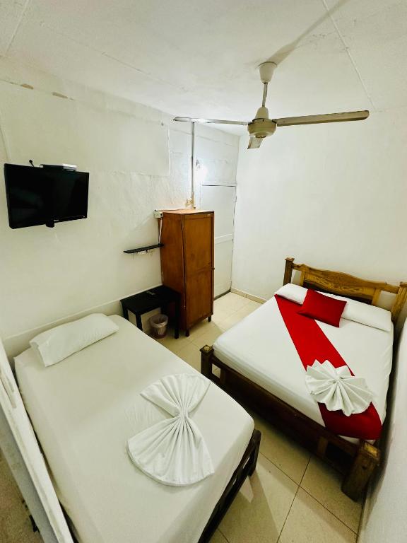 Postel nebo postele na pokoji v ubytování Hostal La Española de Getsemani