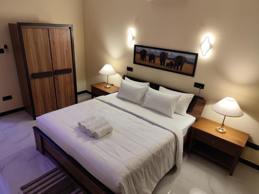 Postel nebo postele na pokoji v ubytování Villa Infinity Negombo