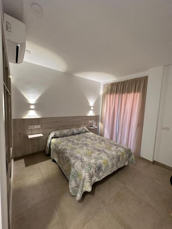 Postel nebo postele na pokoji v ubytování RAQUEL'S - Habitacions i Apartaments turístics -