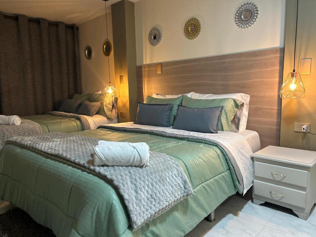 Postel nebo postele na pokoji v ubytování Provenza Medellin Hotel Boutique