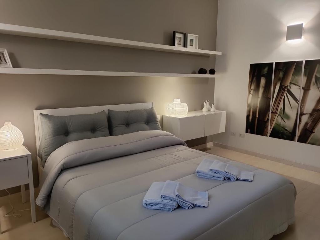 Postel nebo postele na pokoji v ubytování Loft Nel Borgo