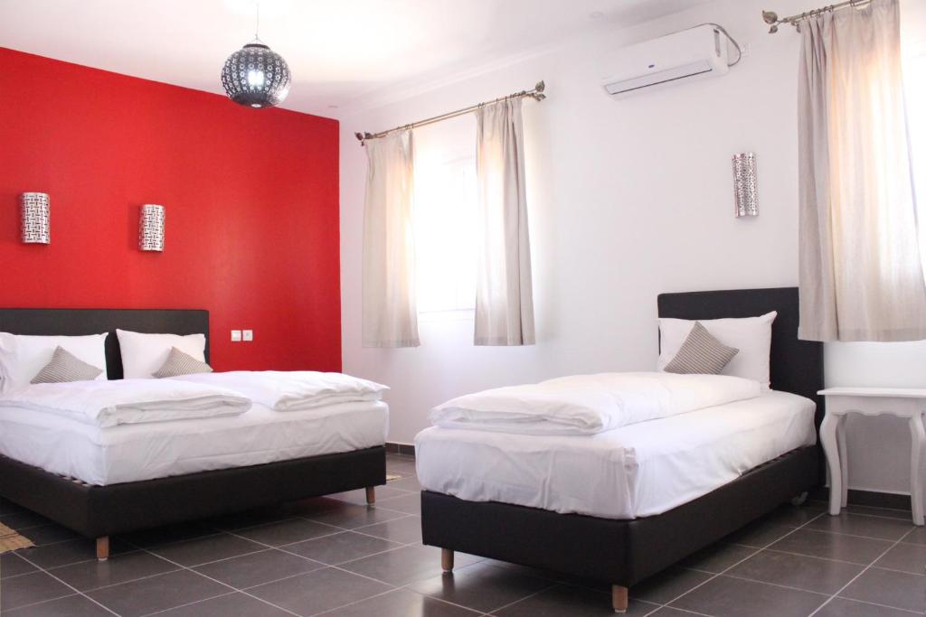 Postel nebo postele na pokoji v ubytování Auberge Tinit