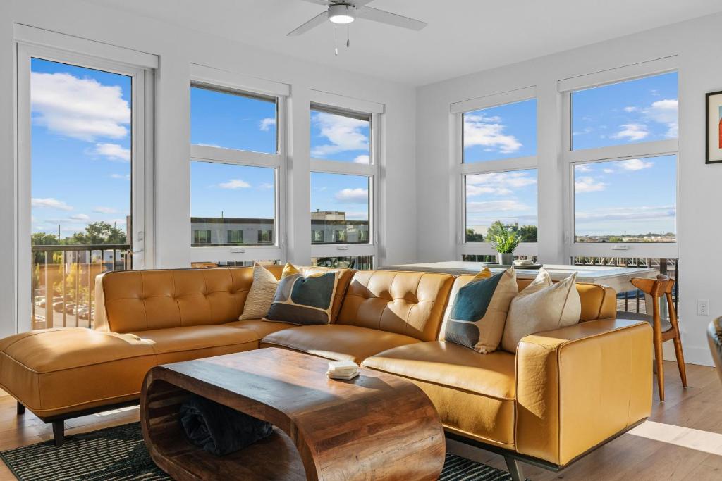 a living room with a couch and a table at Superb NEW 2BR amazing amenities in Salt Lake City