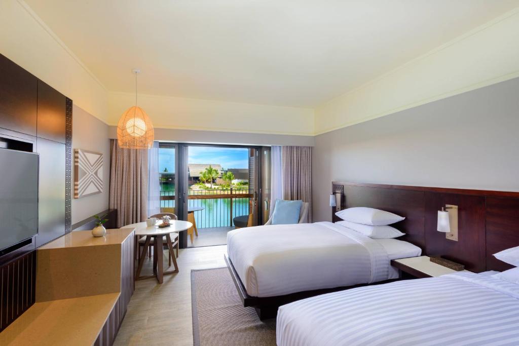 Postel nebo postele na pokoji v ubytování Fiji Marriott Resort Momi Bay