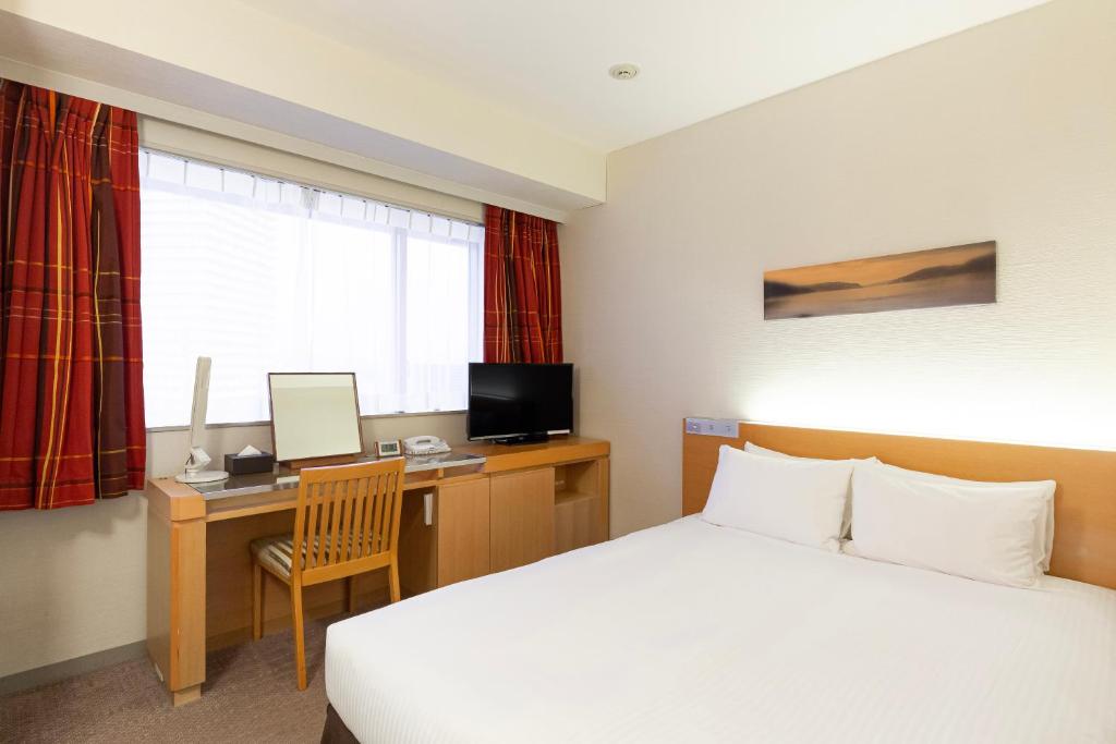 TV a/nebo společenská místnost v ubytování Hotel Keihan Kyobashi Grande