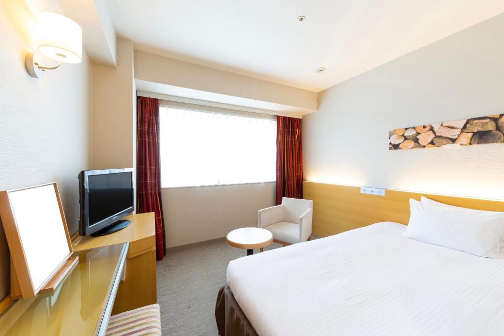 TV a/nebo společenská místnost v ubytování Hotel Keihan Kyobashi Grande