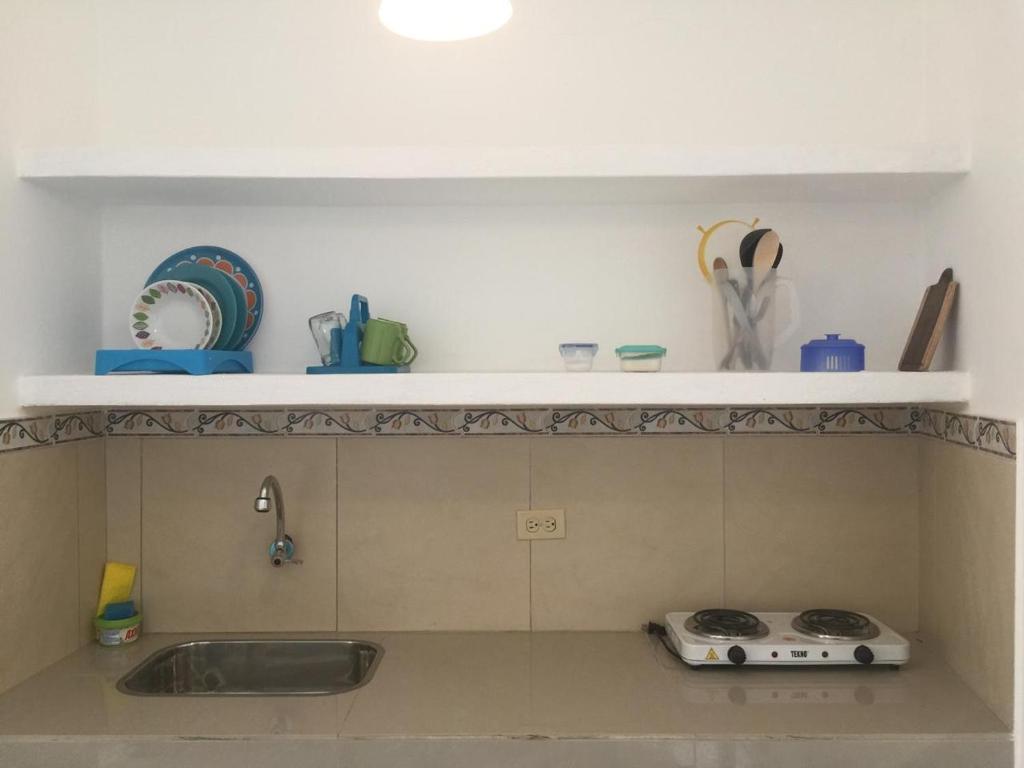 a kitchen with a sink and a counter top at Casa Bella Salinas in Salinas