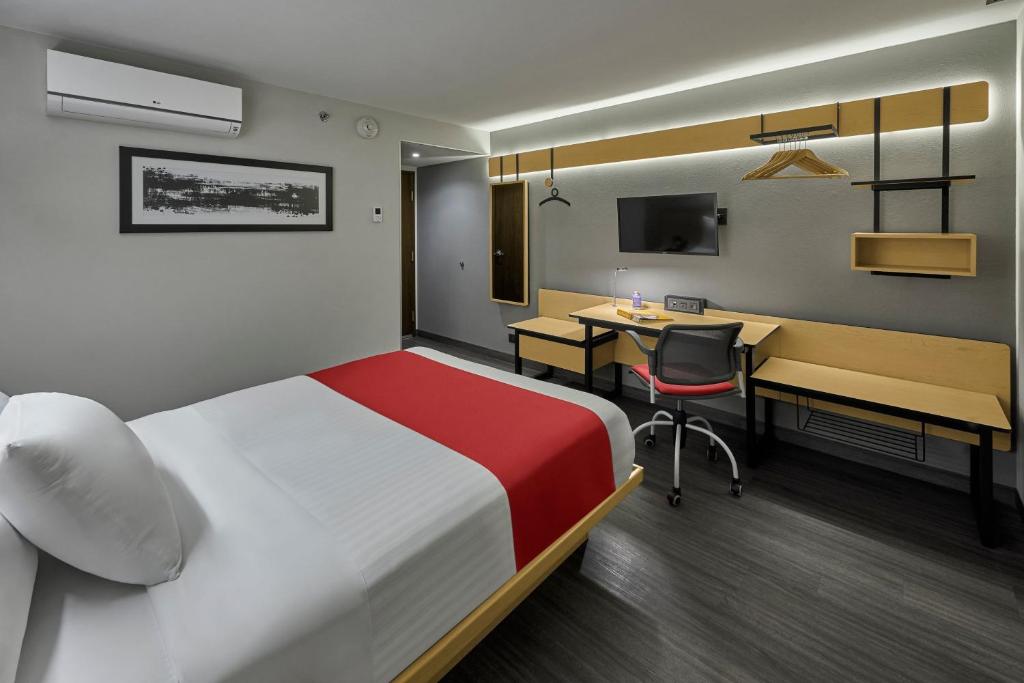 TV a/nebo společenská místnost v ubytování City Express by Marriott Veracruz