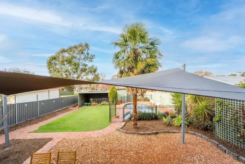 a view of a house with a tent and a yard at Cambridge House, Bendigo in Bendigo