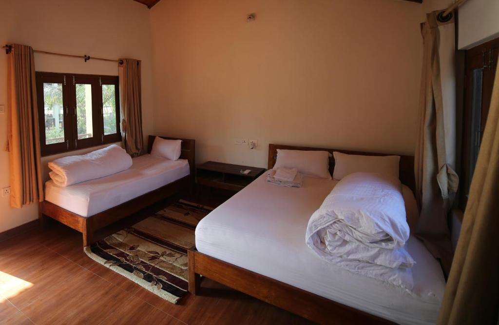 Postel nebo postele na pokoji v ubytování Bardia Eco Friendly Homestay