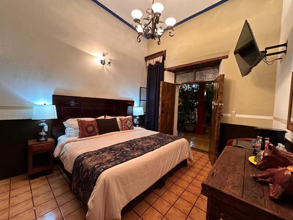 Postel nebo postele na pokoji v ubytování Copa de Oro Hotel Boutique