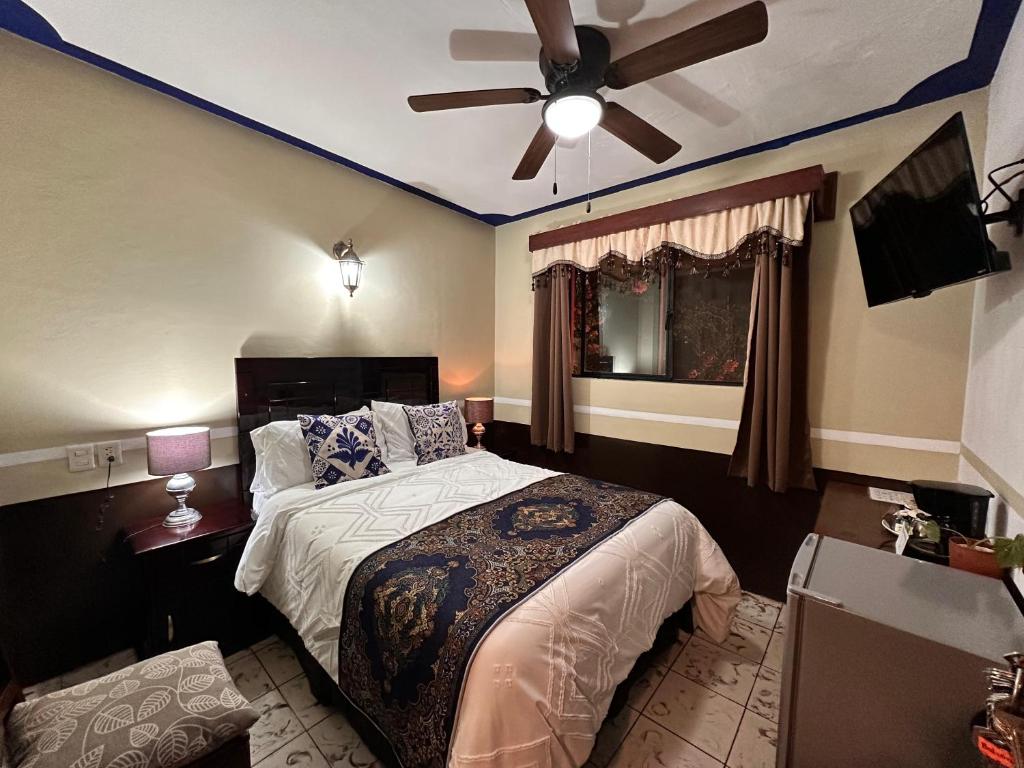 Postel nebo postele na pokoji v ubytování Copa de Oro Hotel Boutique