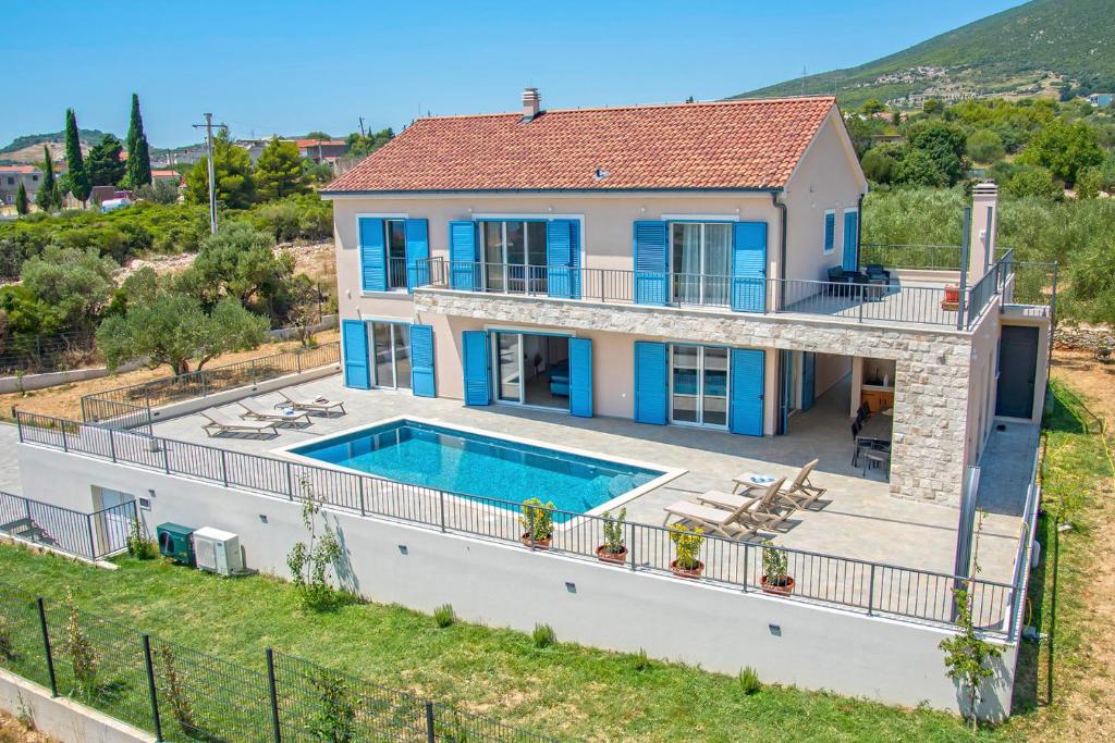 an aerial view of a house with a swimming pool at Villa J&J in Kastel Novi