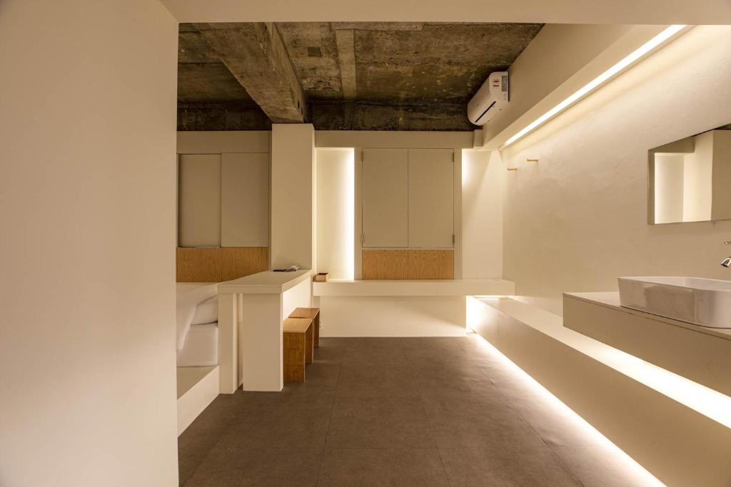Postel nebo postele na pokoji v ubytování ADO hotel