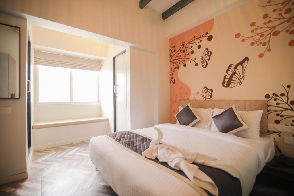 Postel nebo postele na pokoji v ubytování La Papillon Maison