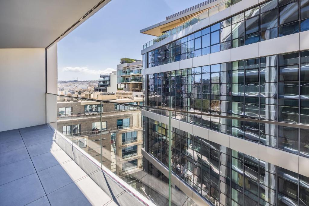 a view from the balcony of a building at The Signature Suite in Mercury Tower in St. Julianʼs