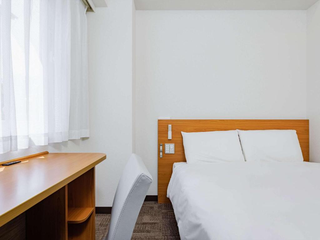 Postel nebo postele na pokoji v ubytování Comfort Inn Kofu Isawa