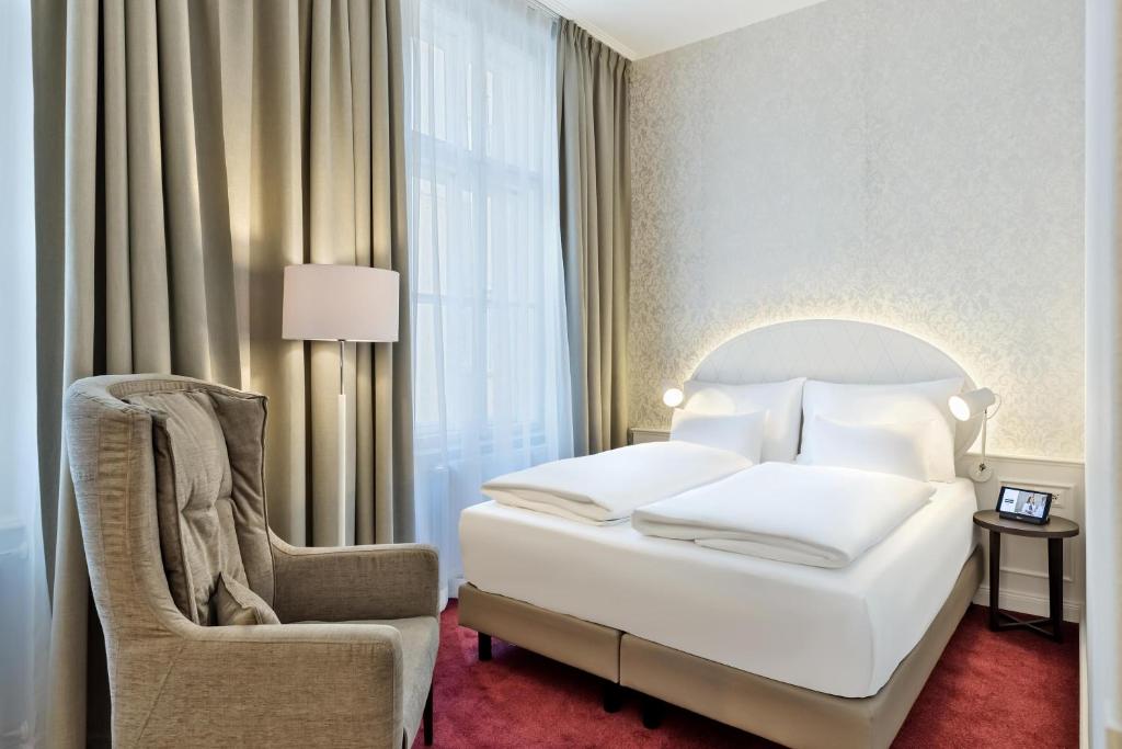 Postel nebo postele na pokoji v ubytování Hotel Rathauspark Wien, a member of Radisson Individuals