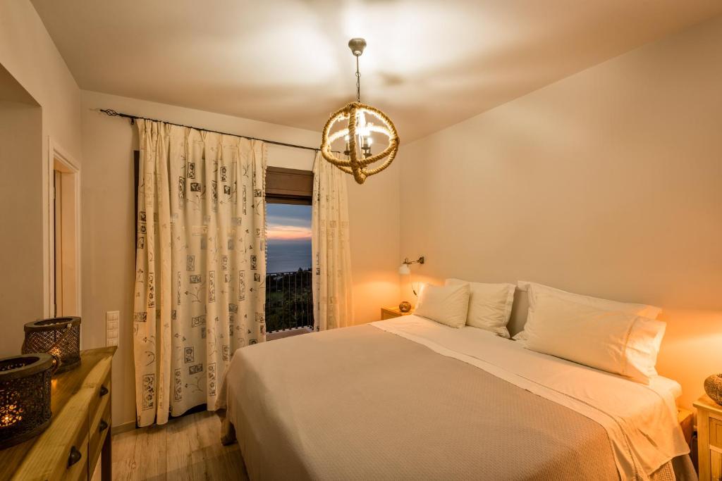 Postel nebo postele na pokoji v ubytování Yades Villas