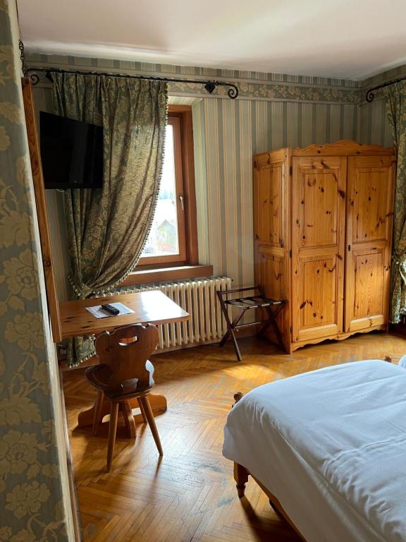 Postel nebo postele na pokoji v ubytování Hotel Albergo Dolomiti