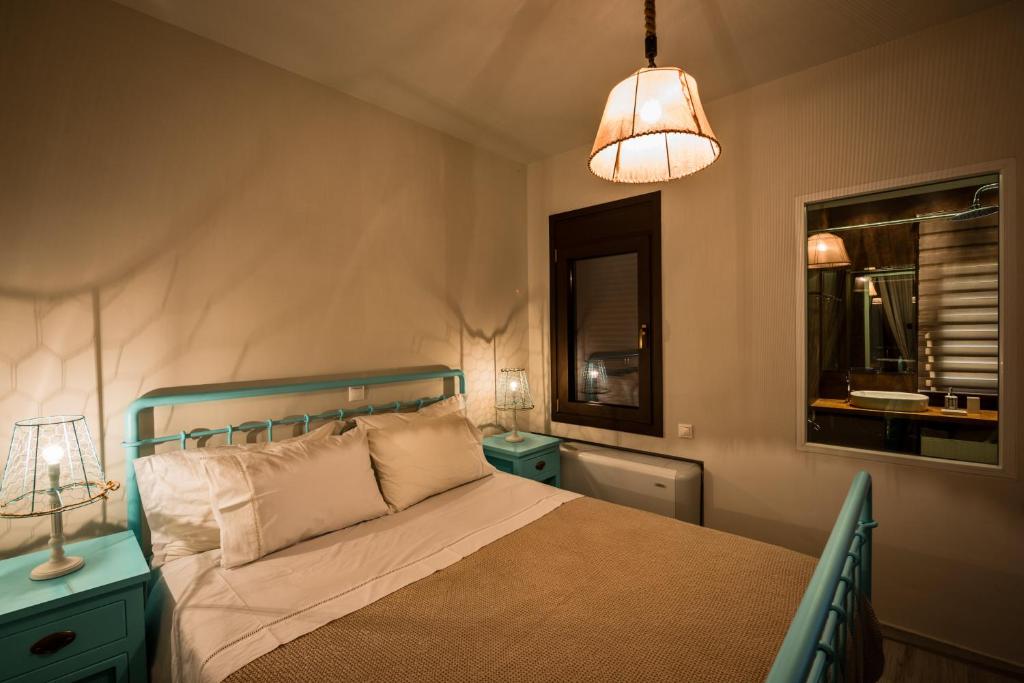 Postel nebo postele na pokoji v ubytování Yades Villas