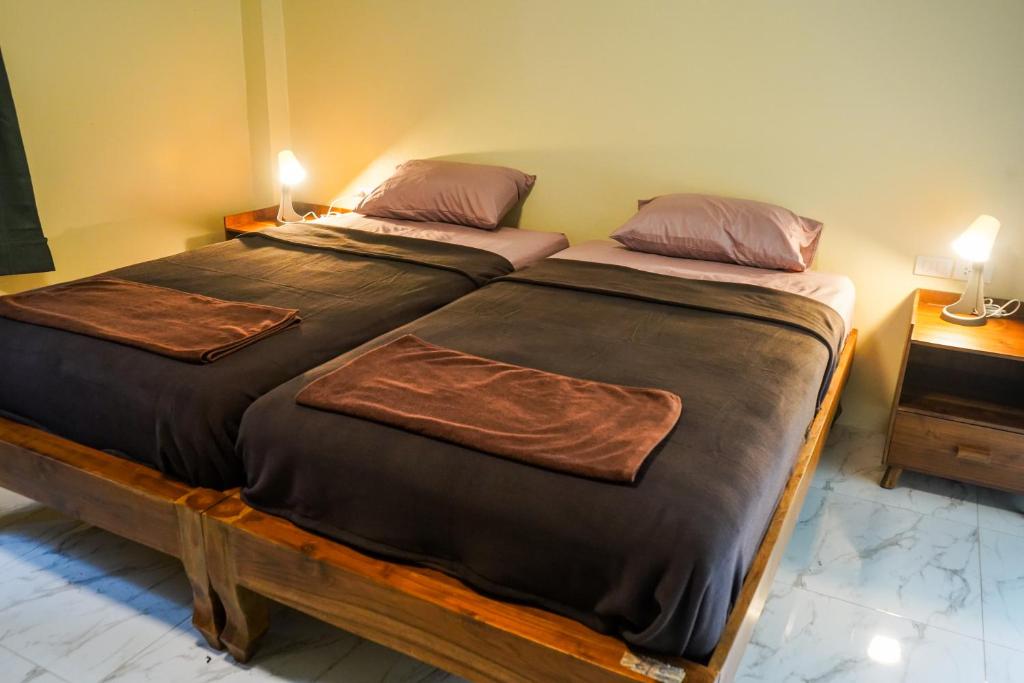 Postel nebo postele na pokoji v ubytování honeyhome kohkood