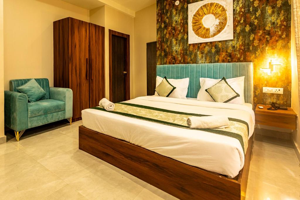 Postel nebo postele na pokoji v ubytování Hotel Vedangam