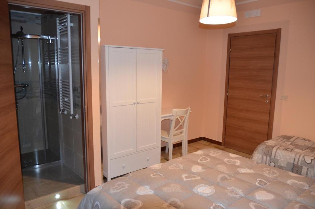 Łóżko lub łóżka w pokoju w obiekcie Agriturismo Valle Verde