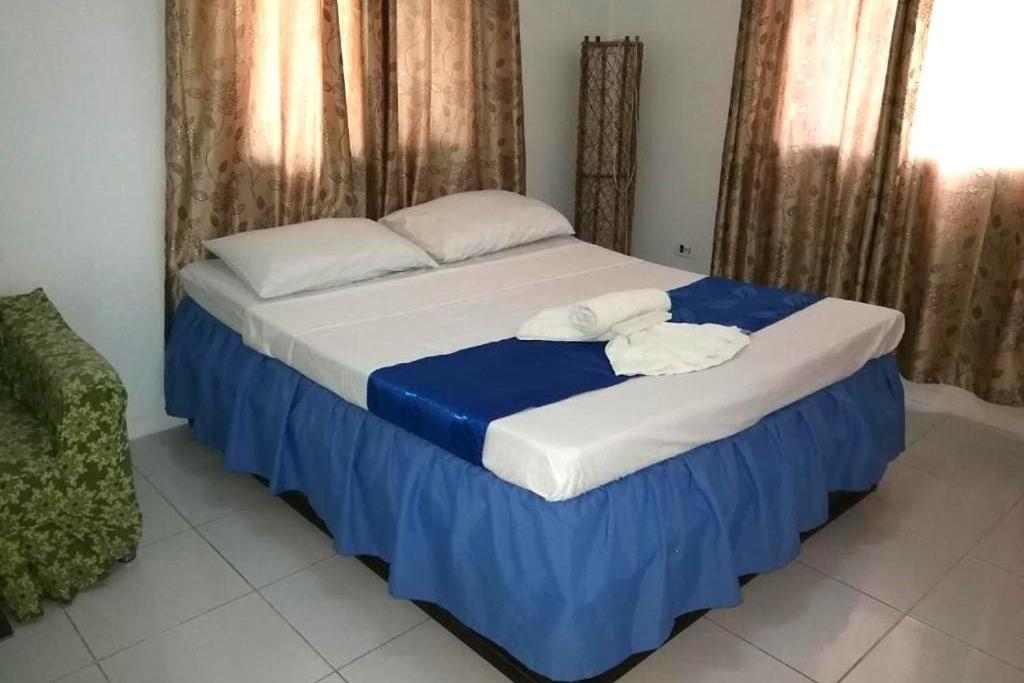 Postel nebo postele na pokoji v ubytování Bellevue Resort Puerto Galera