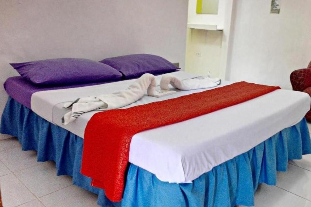 Postel nebo postele na pokoji v ubytování Bellevue Resort Puerto Galera