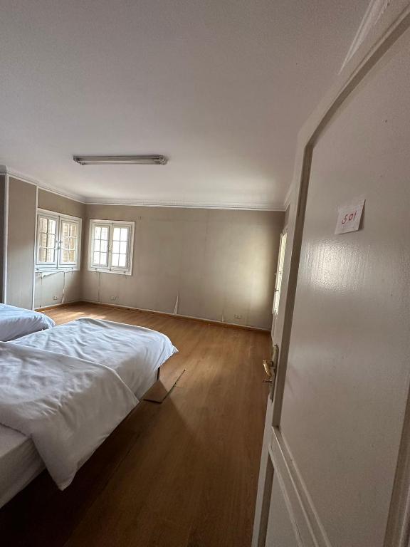 Postel nebo postele na pokoji v ubytování QinFu HOTEL
