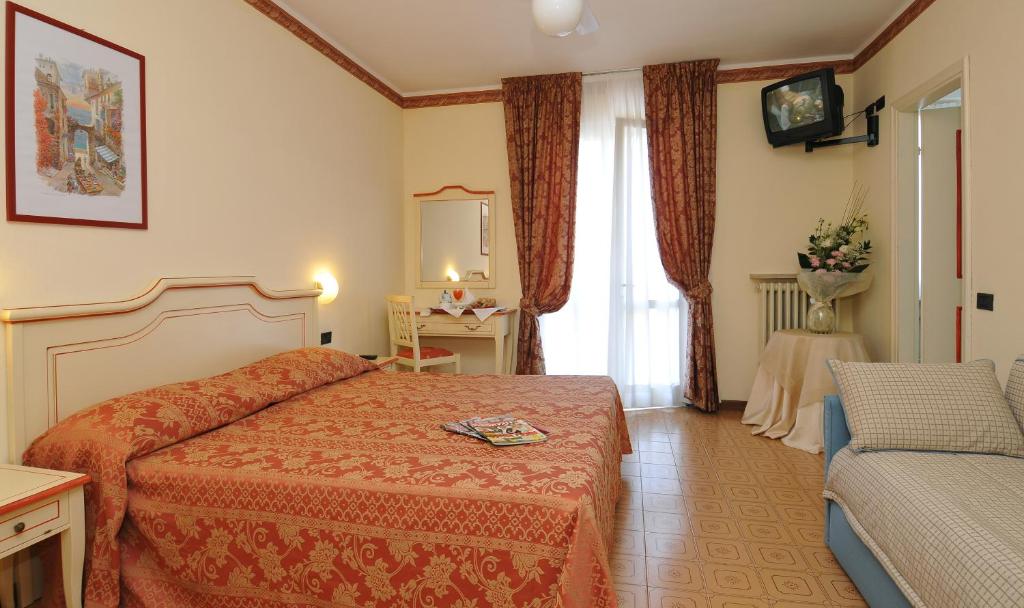 Postel nebo postele na pokoji v ubytování La Quiete Park Hotel