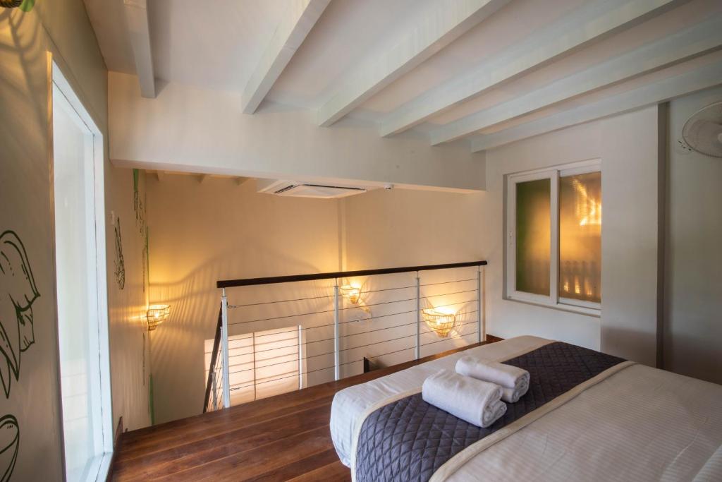 Postel nebo postele na pokoji v ubytování La Papillon Maison