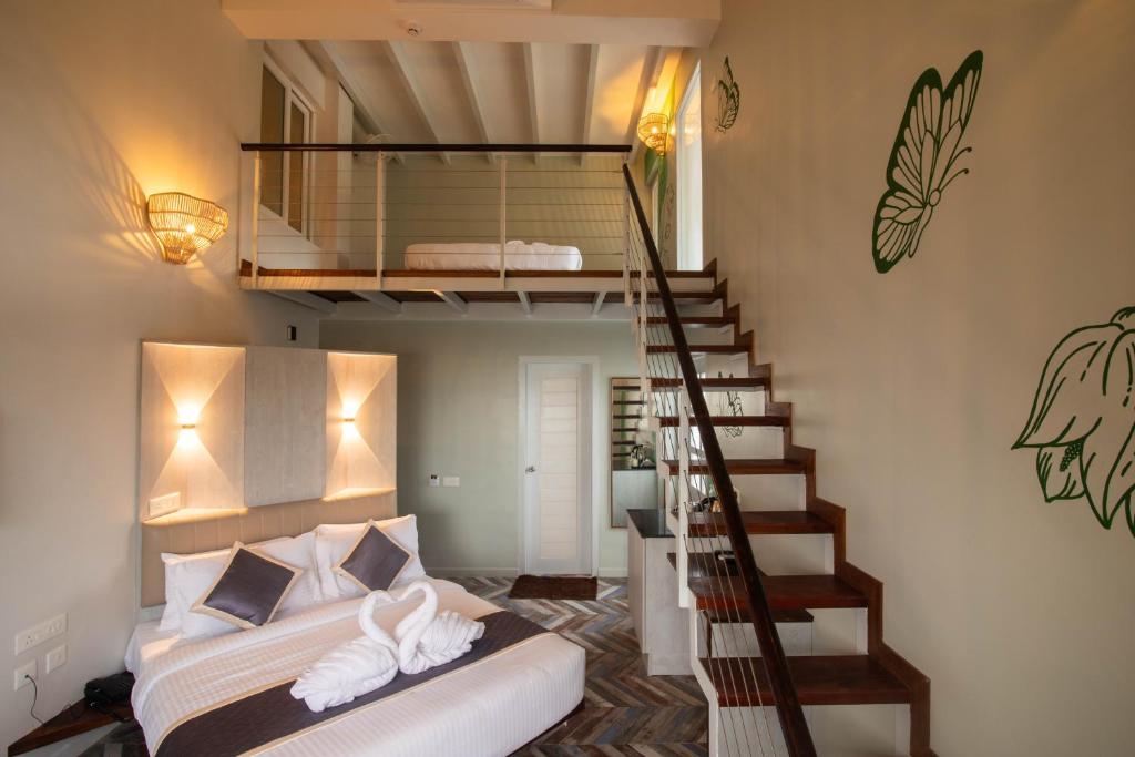 Postel nebo postele na pokoji v ubytování La Papillon Maison